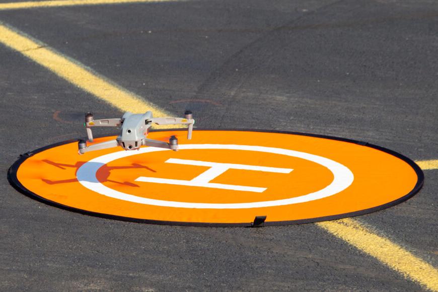 drone on helicopter pad